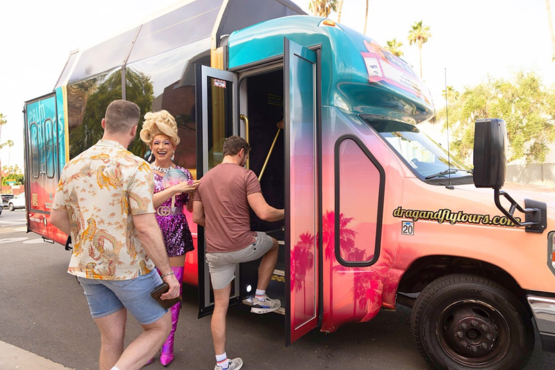 Guests climbing aboard the Drag & Fly custom coach for an entertaining tour of Palm Springs led by drag queens.